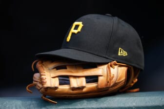 Jun 30, 2021; Denver, Colorado, USA; A general view of a Pittsburgh Pirates glove and hat in the eighth inning against the Colorado Rockies at Coors Field. Mandatory Credit: Isaiah J. Downing-USA TODAY Sports