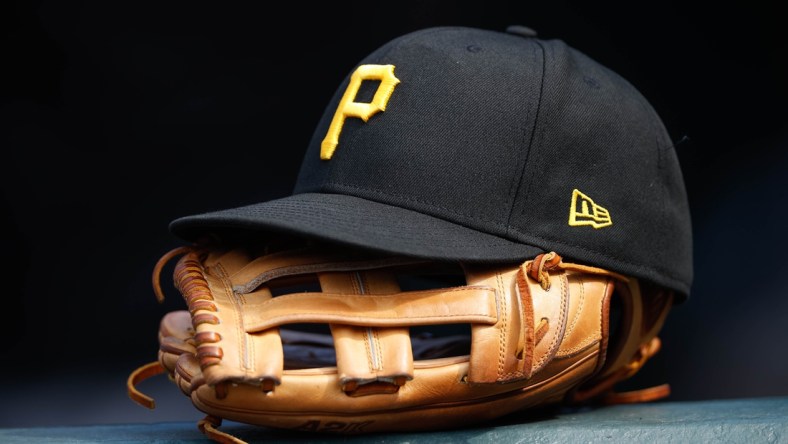 Jun 30, 2021; Denver, Colorado, USA; A general view of a Pittsburgh Pirates glove and hat in the eighth inning against the Colorado Rockies at Coors Field. Mandatory Credit: Isaiah J. Downing-USA TODAY Sports