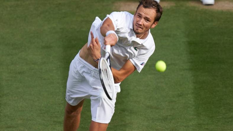 Jul 3, 2021; London, United Kingdom;  
Daniil Medvedev (RUS) plays Marin Cilic (CRO) on No 1 court in the men's third round at All England Lawn Tennis and Croquet Club. Mandatory Credit: Peter van den Berg-USA TODAY Sports