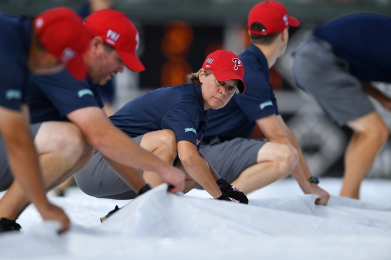 Jul 3, 2021; Philadelphia, Pennsylvania, USA; Citizens Bank Park ground's crew remove the field tarp after a rain delay before the game between the Philadelphia Phillies and San Diego Padres at Citizens Bank Park. Mandatory Credit: Kyle Ross-USA TODAY Sports