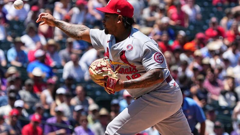 Jul 4, 2021; Denver, Colorado, USA; St. Louis Cardinals starting pitcher Carlos Martinez (18) delivers a pitch in the second inning against the Colorado Rockies at Coors Field. Mandatory Credit: Ron Chenoy-USA TODAY Sports