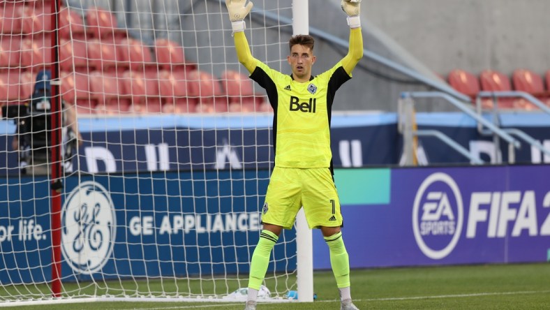 Jul 17, 2021; Sandy, Utah, USA; Vancouver Whitecaps goalkeeper Thomas Hasal (1) instructs his team during the first half of a match against the Los Angeles Galaxy at Rio Tinto Stadium. Mandatory Credit: Rob Gray-USA TODAY Sports