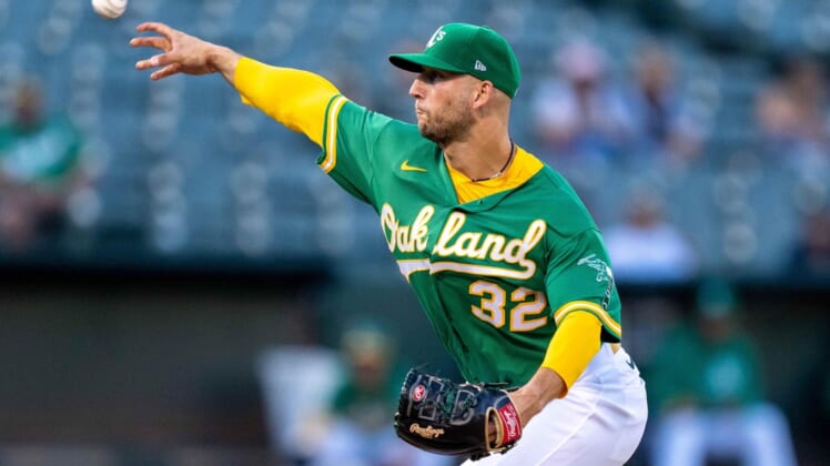 Aug 26, 2021; Oakland, California, USA;  Oakland Athletics starting pitcher James Kaprielian (32) delivers against the New York Yankees during the first inning at RingCentral Coliseum. Mandatory Credit: Neville E. Guard-USA TODAY Sports