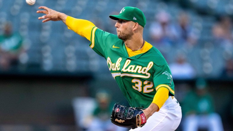 Aug 26, 2021; Oakland, California, USA;  Oakland Athletics starting pitcher James Kaprielian (32) delivers against the New York Yankees during the first inning at RingCentral Coliseum. Mandatory Credit: Neville E. Guard-USA TODAY Sports