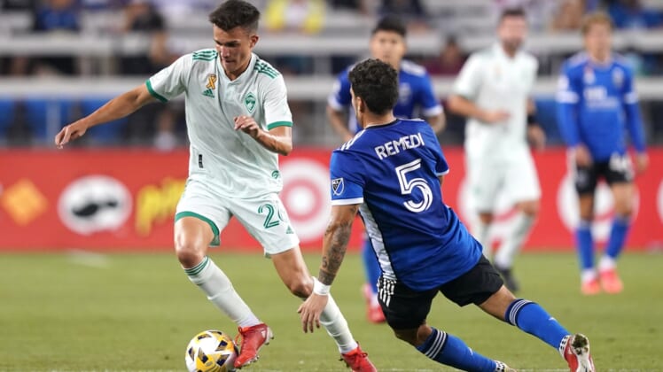 Sep 4, 2021; San Jose, California, USA; Colorado Rapids midfielder Cole Bassett (26) dribbles while being defended by San Jose Earthquakes midfielder Eric Remedi (5) during the first half at PayPal Park. Mandatory Credit: Darren Yamashita-USA TODAY Sports