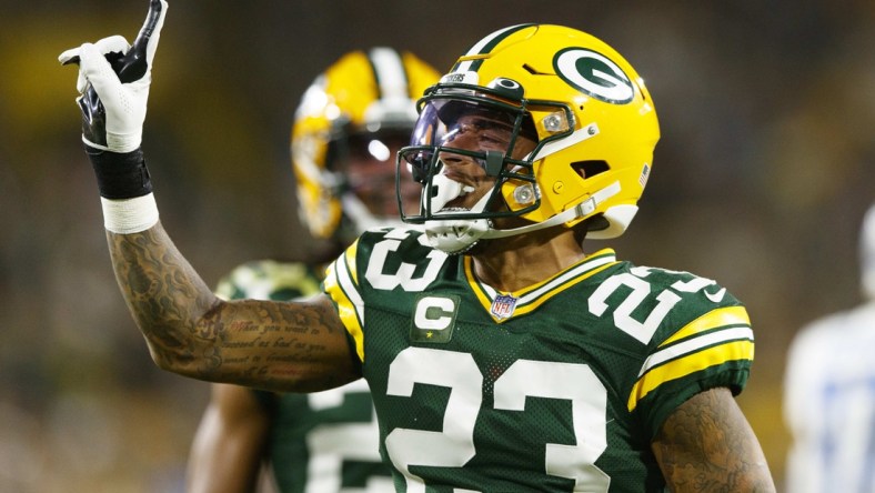 Sep 20, 2021; Green Bay, Wisconsin, USA;  Green Bay Packers cornerback Jaire Alexander (23) celebrates after breaking up a pass during the second quarter against the Detroit Lions at Lambeau Field. Mandatory Credit: Jeff Hanisch-USA TODAY Sports