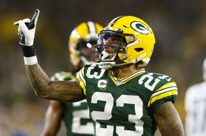 Sep 20, 2021; Green Bay, Wisconsin, USA;  Green Bay Packers cornerback Jaire Alexander (23) celebrates after breaking up a pass during the second quarter against the Detroit Lions at Lambeau Field. Mandatory Credit: Jeff Hanisch-USA TODAY Sports