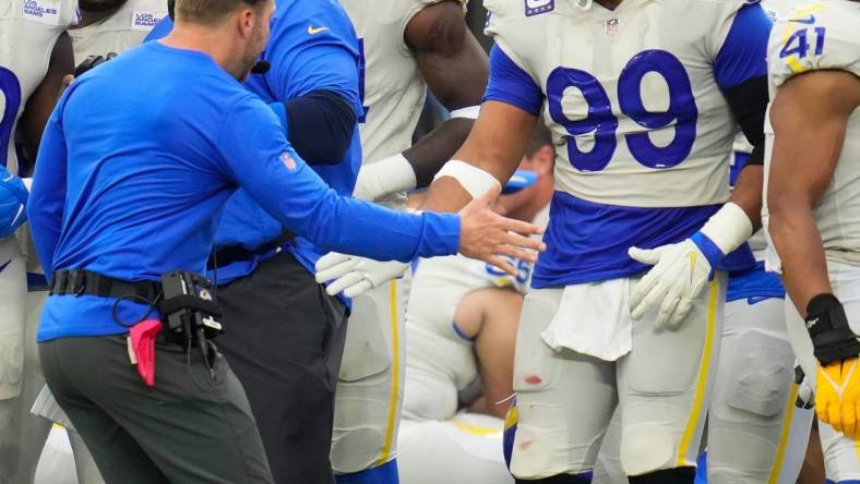 Sep 26, 2021; Inglewood, California, USA; Los Angeles Rams head coach Sean McVay celebrates with defensive end Aaron Donald (99) as time runs out in the Rams win over the Tampa Bay Buccaneers at SoFi Stadium. Mandatory Credit: Robert Hanashiro-USA TODAY Sports