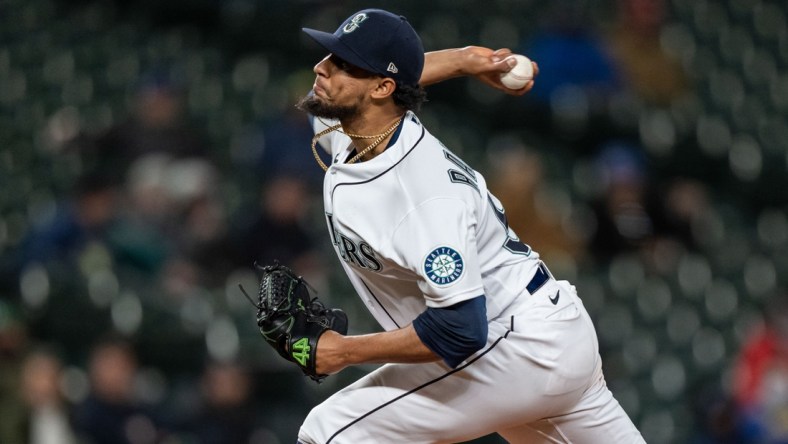 Sep 27, 2021; Seattle, Washington, USA;  Seattle Mariners reliever Yohan Ramirez (55) delivers a pitch during a game against the Oakland Athletics at T-Mobile Park. The Mariners won 13-4. Mandatory Credit: Stephen Brashear-USA TODAY Sports