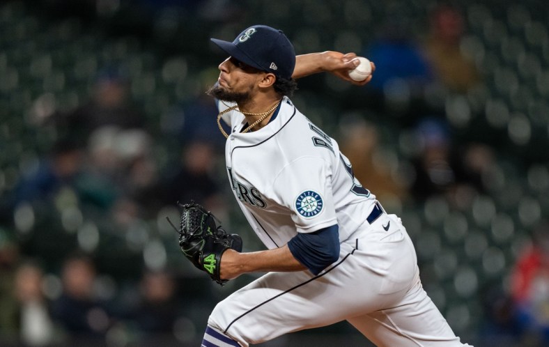 Sep 27, 2021; Seattle, Washington, USA;  Seattle Mariners reliever Yohan Ramirez (55) delivers a pitch during a game against the Oakland Athletics at T-Mobile Park. The Mariners won 13-4. Mandatory Credit: Stephen Brashear-USA TODAY Sports