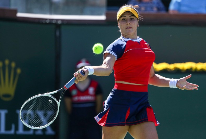 Bianca Andreescu of Canada returns the ball to Anett Kontaveit of Estonia during their round three match of the BNP Paribas Open, Monday, Oct. 11, 2021, in Indian Wells, Calif.