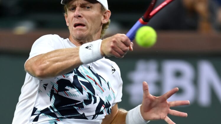 Oct 12, 2021; Indian Wells, CA, USA; Kevin Anderson (RSA) hits a shot against Gael Monfils (FRA) during a third round match in the BNP Paribas Open at the Indian Wells Tennis Garden. Mandatory Credit: Jayne Kamin-Oncea-USA TODAY Sports