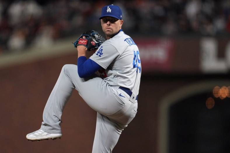 Oct 14, 2021; San Francisco, California, USA; Los Angeles Dodgers relief pitcher Blake Treinen (49) throws against the San Francisco Giants during the seventh inning in game five of the 2021 NLDS at Oracle Park. Mandatory Credit: Neville E. Guard-USA TODAY Sports