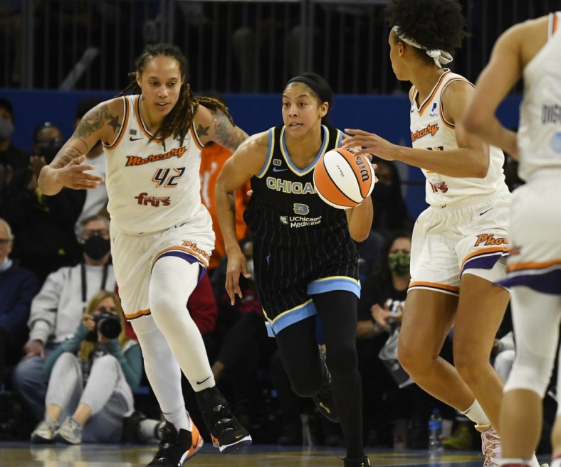 Oct 17, 2021; Chicago, Illinois, USA; Chicago Sky guard/forward Kahleah Copper (2) drives with the ball against Phoenix Mercury center Brittney Griner (42) and Phoenix Mercury forward Brianna Turner (21), right, during the second half of game four of the 2021 WNBA Finals at Wintrust Arena. Mandatory Credit: Matt Marton-USA TODAY Sports