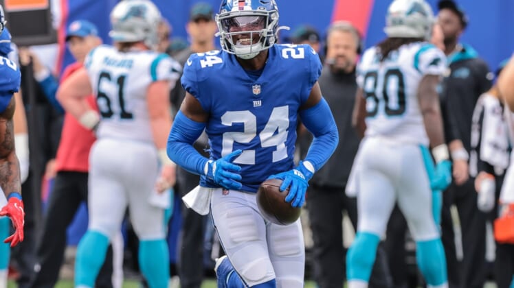 Oct 24, 2021; East Rutherford, New Jersey, USA; New York Giants cornerback James Bradberry (24) reacts after an interception against the Carolina Panthers during the first half at MetLife Stadium. Mandatory Credit: Vincent Carchietta-USA TODAY Sports