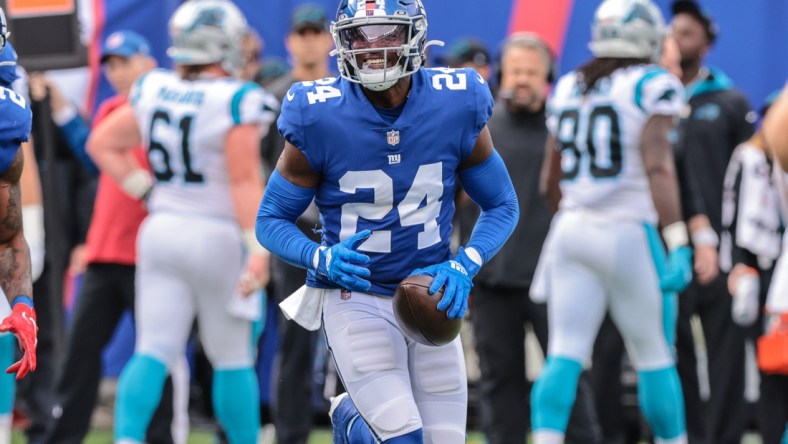 Oct 24, 2021; East Rutherford, New Jersey, USA; New York Giants cornerback James Bradberry (24) reacts after an interception against the Carolina Panthers during the first half at MetLife Stadium. Mandatory Credit: Vincent Carchietta-USA TODAY Sports