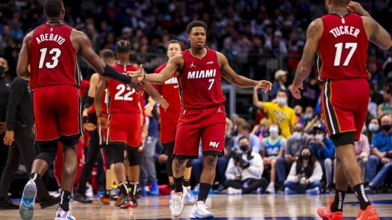 Nov 2, 2021; Dallas, Texas, USA;  Miami Heat guard Kyle Lowry (7) celebrates with center Bam Adebayo (13) and  forward P.J. Tucker (17) during the fourth quarter against the Dallas Mavericks at American Airlines Center. Mandatory Credit: Kevin Jairaj-USA TODAY Sports