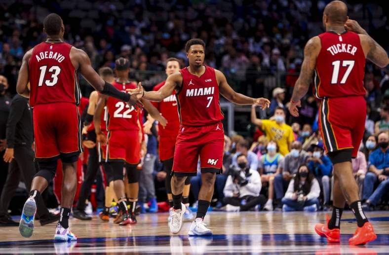 Nov 2, 2021; Dallas, Texas, USA;  Miami Heat guard Kyle Lowry (7) celebrates with center Bam Adebayo (13) and  forward P.J. Tucker (17) during the fourth quarter against the Dallas Mavericks at American Airlines Center. Mandatory Credit: Kevin Jairaj-USA TODAY Sports