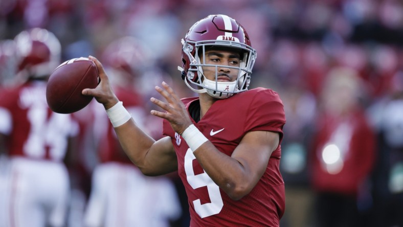 Nov 6, 2021; Tuscaloosa, Alabama, USA; Alabama Crimson Tide quarterback Bryce Young (9) warms up before the start against the LSU Tigers at Bryant-Denny Stadium. Mandatory Credit: Butch Dill-USA TODAY Sports