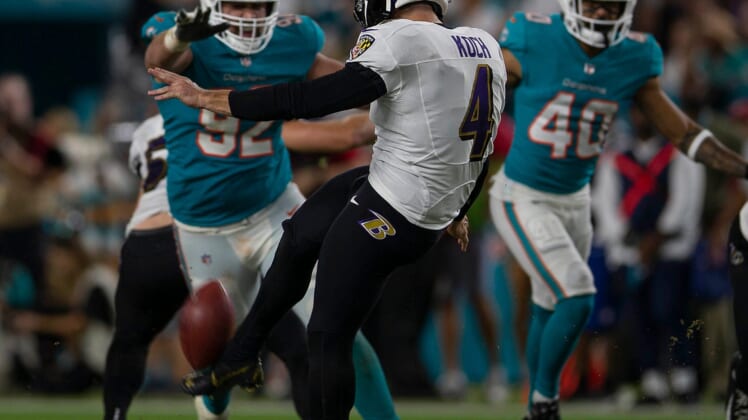 Baltimore Ravens punter Sam Koch (4) punts against the Miami Dolphins during NFL game at Hard Rock Stadium Thursday in Miami Gardens.Baltimore Ravens V Miami Dolphins 063