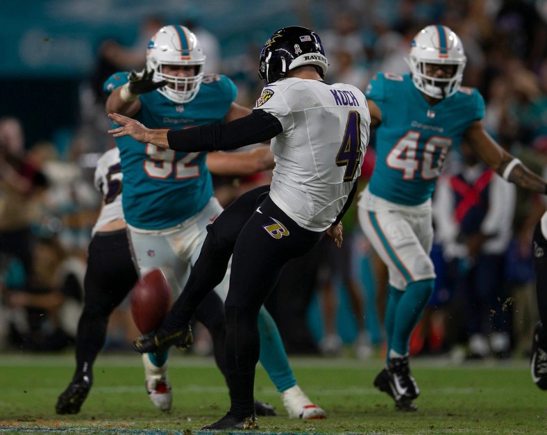 Baltimore Ravens punter Sam Koch (4) punts against the Miami Dolphins during NFL game at Hard Rock Stadium Thursday in Miami Gardens.

Baltimore Ravens V Miami Dolphins 063