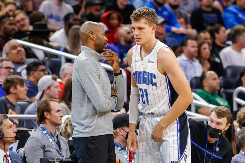 Nov 13, 2021; Orlando, Florida, USA; Orlando Magic head coach Jamahl Mosley talks to center Moritz Wagner (21) during the second quarter at Amway Center. Mandatory Credit: Mike Watters-USA TODAY Sports