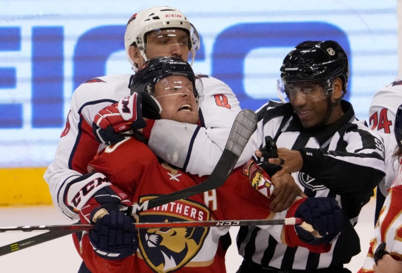 Nov 30, 2021; Sunrise, Florida, USA; Washington Capitals left wing Alex Ovechkin (8) holds onto Florida Panthers right wing Patric Hornqvist (70) during scuffle in the second period at FLA Live Arena. Mandatory Credit: Jasen Vinlove-USA TODAY Sports