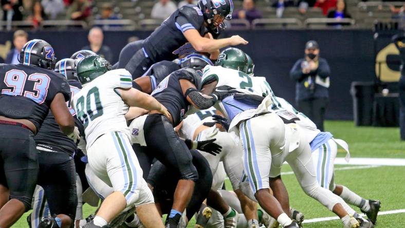 Zachary quarterback Eli Holstein (10) leaps in for a 1-yard score in the third quarter of the Class 5A State Championship game between Ponchatoula and Zachary at the Caesars Superdome on Saturday, December 11, 2021. (Michael DeMocker)

Class5achamp07