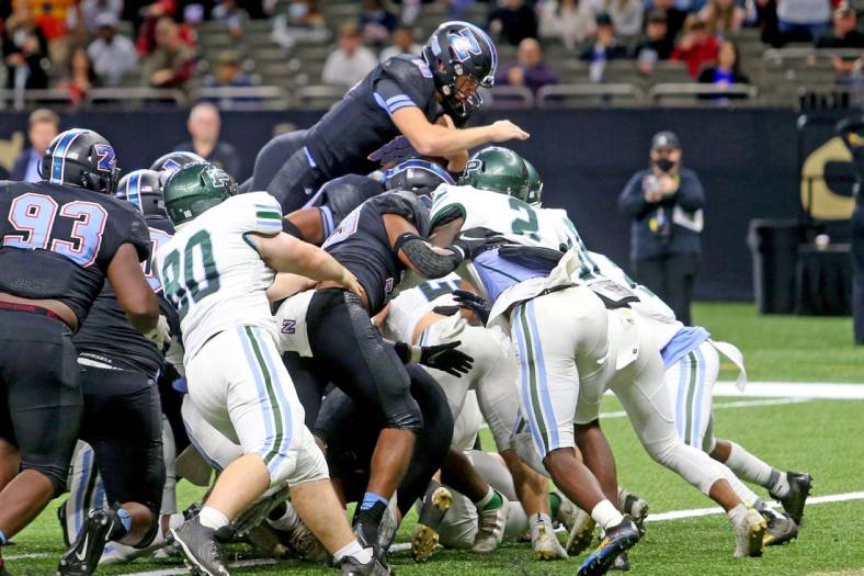 Zachary quarterback Eli Holstein (10) leaps in for a 1-yard score in the third quarter of the Class 5A State Championship game between Ponchatoula and Zachary at the Caesars Superdome on Saturday, December 11, 2021. (Michael DeMocker)

Class5achamp07