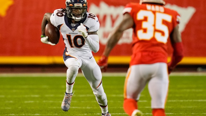 Dec 5, 2021; Kansas City, Missouri, USA; Denver Broncos wide receiver Jerry Jeudy (10) runs the ball as Kansas City Chiefs cornerback Charvarius Ward (35) defends during the second half at GEHA Field at Arrowhead Stadium. Mandatory Credit: Jay Biggerstaff-USA TODAY Sports