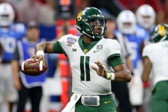 Jan 1, 2022; New Orleans, LA, USA; Baylor Bears quarterback Gerry Bohanon (11) throws a pass against the Mississippi Rebels in the third quarter of the 2022 Sugar Bowl at the Caesars Superdome. Mandatory Credit: Chuck Cook-USA TODAY Sports