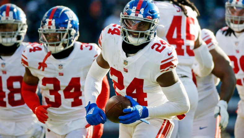 Jan 2, 2022; Chicago, Illinois, USA; New York Giants cornerback James Bradberry (24) reacts after intercepting a pass against the Chicago Bears during the second half at Soldier Field. Mandatory Credit: Jon Durr-USA TODAY Sports