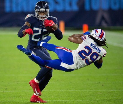 Tennessee Titans running back Derrick Henry (22) throws Buffalo Bills cornerback Josh Norman (29) aside as he rushes up the field during the second quarter at Nissan Stadium Tuesday, Oct. 13, 2020 in Nashville, Tenn.

Nas Titans Bills 001