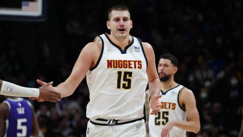 Jan 7, 2022; Denver, Colorado, USA; Denver Nuggets center Nikola Jokic (15) celebrates a score in the second half against the Sacramento Kings at Ball Arena. Mandatory Credit: Ron Chenoy-USA TODAY Sports