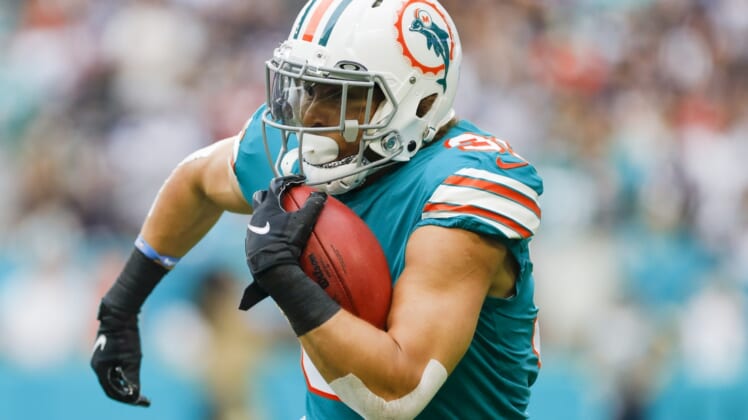 Jan 9, 2022; Miami Gardens, Florida, USA;Miami Dolphins running back Phillip Lindsay (31) runs with the football against the New England Patriots during the first quarter at Hard Rock Stadium. Mandatory Credit: Sam Navarro-USA TODAY Sports
