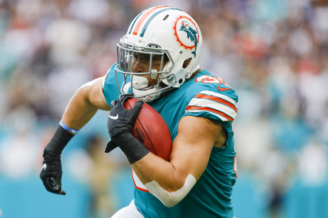 Jan 9, 2022; Miami Gardens, Florida, USA;Miami Dolphins running back Phillip Lindsay (31) runs with the football against the New England Patriots during the first quarter at Hard Rock Stadium. Mandatory Credit: Sam Navarro-USA TODAY Sports