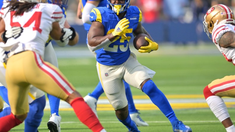 Jan 9, 2022; Inglewood, California, USA;   Los Angeles Rams running back Sony Michel (25) runs for a first down in the first half of the game against the San Francisco 49ers at SoFi Stadium. Mandatory Credit: Jayne Kamin-Oncea-USA TODAY Sports