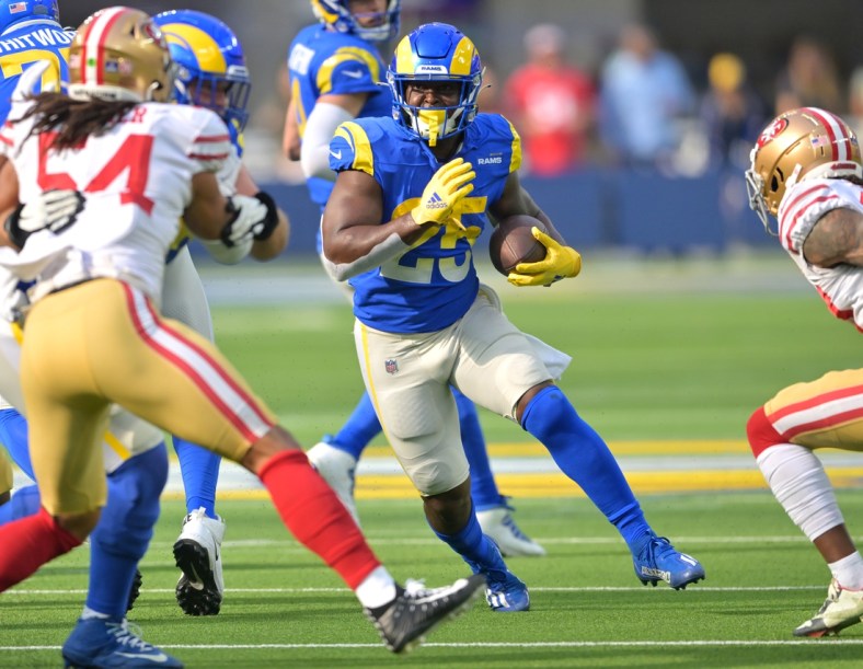 Jan 9, 2022; Inglewood, California, USA;   Los Angeles Rams running back Sony Michel (25) runs for a first down in the first half of the game against the San Francisco 49ers at SoFi Stadium. Mandatory Credit: Jayne Kamin-Oncea-USA TODAY Sports