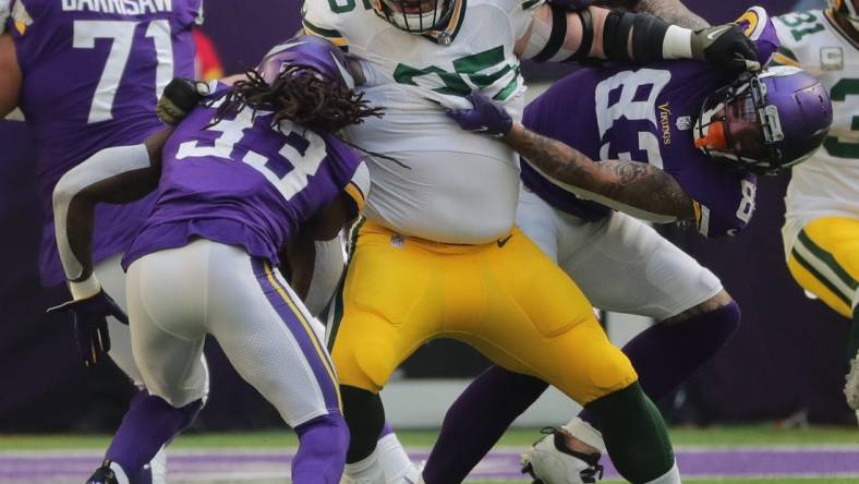 Green Bay Packers defensive tackle Tyler Lancaster (95) fends off a block while tackling Minnesota Vikings running back Dalvin Cook (33) for a three-yard loss during the first  quarter of their game Sunday, November 21, 2021 at U.S. Bank Stadium in Minneapolis, Minn. The Minnesota Vikings beat the Green Bay Packers 34-31.

Mjs Packers22 12 Jpg Packers22