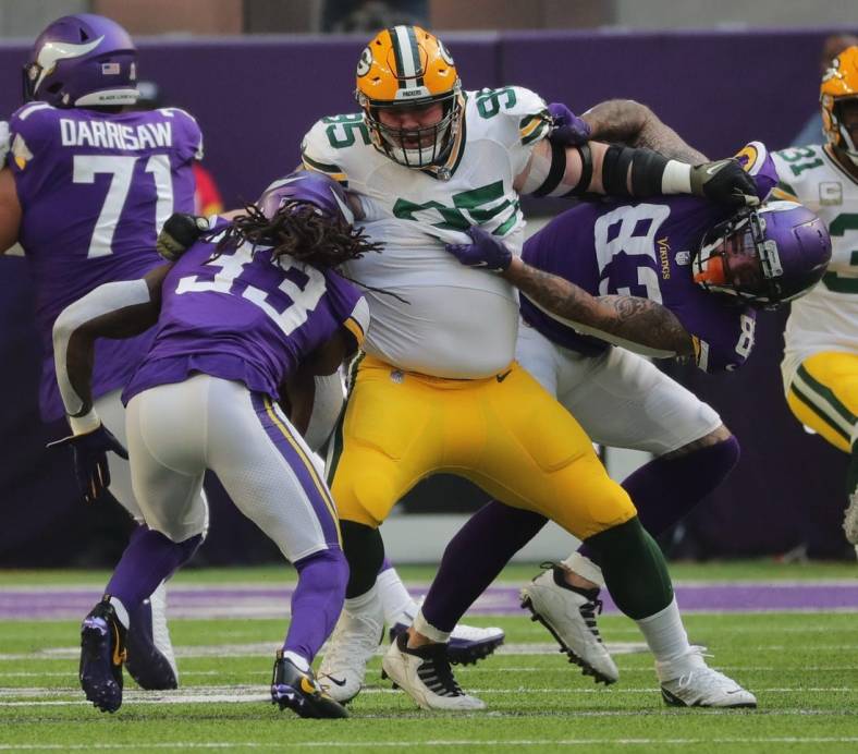 Green Bay Packers defensive tackle Tyler Lancaster (95) fends off a block while tackling Minnesota Vikings running back Dalvin Cook (33) for a three-yard loss during the first  quarter of their game Sunday, November 21, 2021 at U.S. Bank Stadium in Minneapolis, Minn. The Minnesota Vikings beat the Green Bay Packers 34-31.

Mjs Packers22 12 Jpg Packers22