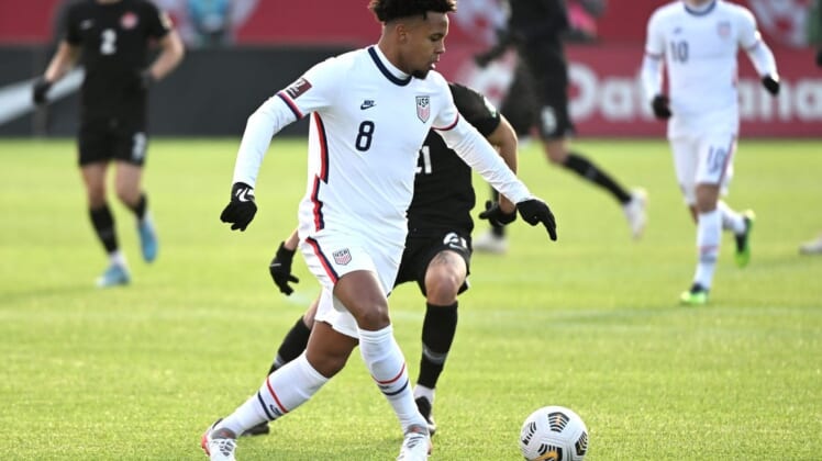 Jan 30, 2022; Hamilton, Ontario, CAN;  United States forward Weston McKennie (8) plays a pass against Canada during a CONCACAF FIFA World Cup Qualifier soccer match at Tim Hortons Field. Mandatory Credit: Dan Hamilton-USA TODAY Sports