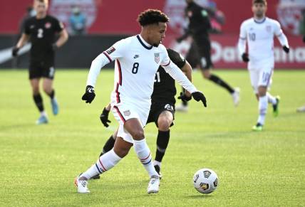 Jan 30, 2022; Hamilton, Ontario, CAN;  United States forward Weston McKennie (8) plays a pass against Canada during a CONCACAF FIFA World Cup Qualifier soccer match at Tim Hortons Field. Mandatory Credit: Dan Hamilton-USA TODAY Sports