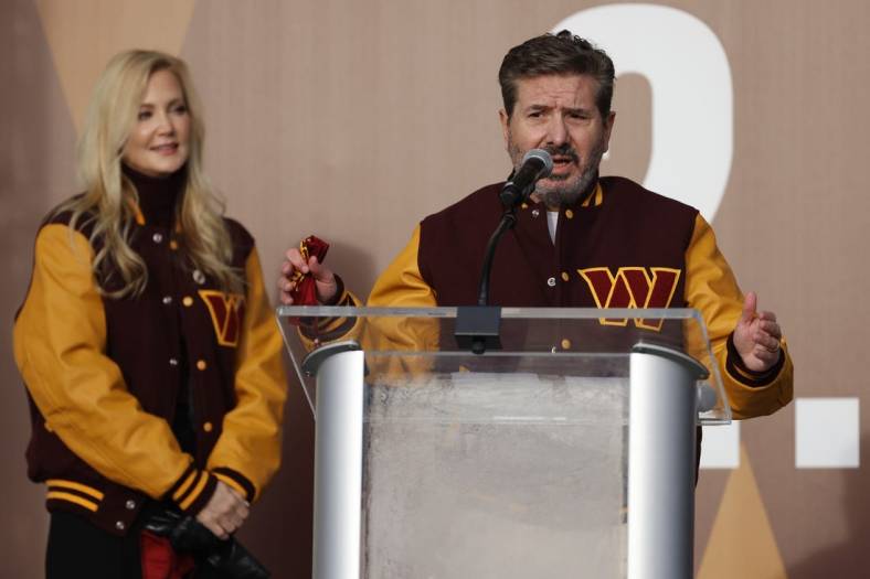 Feb 2, 2022; Landover, MD, USA; Washington Commanders co-owner Dan Snyder speaks as co-owner Tanya Snyder (L) listens during a press conference revealing the Commanders as the new name for the formerly named Washington Football Team at FedEx Field. Mandatory Credit: Geoff Burke-USA TODAY Sports