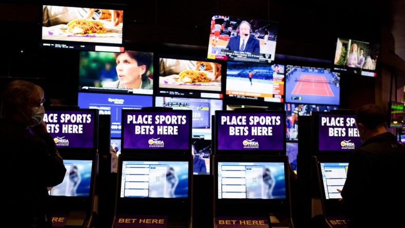 Customers place bets at a kiosks, Thursday, Feb. 10, 2022, at the Oneida Casino in Green Bay, Wis. Samantha Madar/USA TODAY NETWORK-Wisconsin

Gpg Oneida Sports Wagering Lounge 02102022 0014