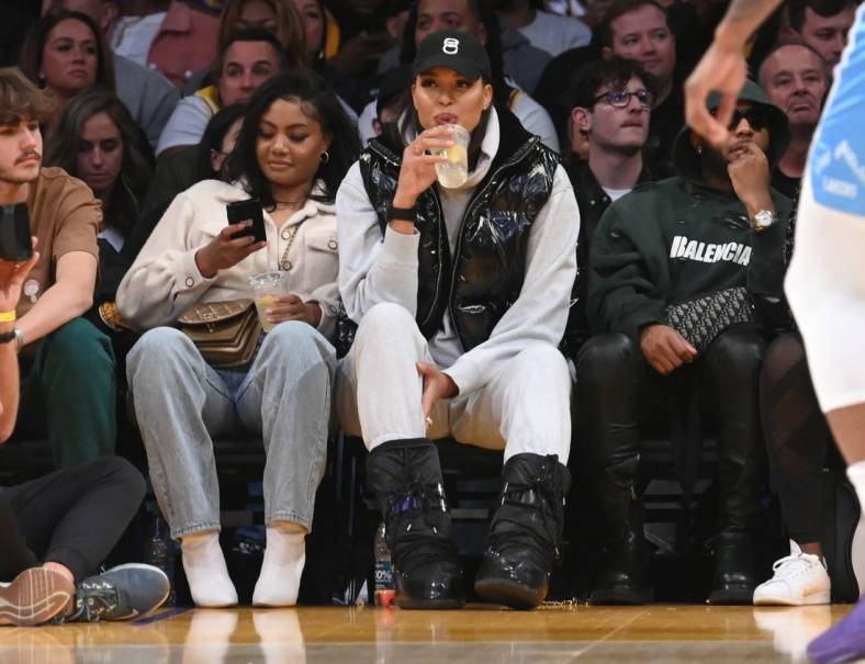 Feb 25, 2022; Los Angeles, California, USA;  Los Angeles Sparks Liz Cambage, center, attends the game between the Los Angeles Lakers and the Los Angeles Clippers at Crypto.com Arena. Mandatory Credit: Jayne Kamin-Oncea-USA TODAY Sports