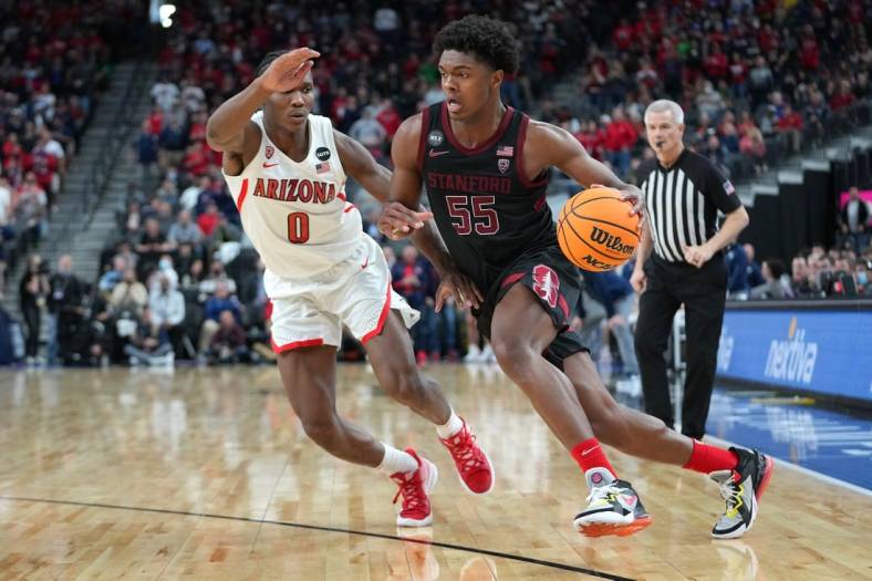 Mar 10, 2022; Las Vegas, NV, USA; Stanford Cardinal forward Harrison Ingram (55) dribbles against Arizona Wildcats guard Bennedict Mathurin (0) during the second half at T-Mobile Arena. Mandatory Credit: Stephen R. Sylvanie-USA TODAY Sports