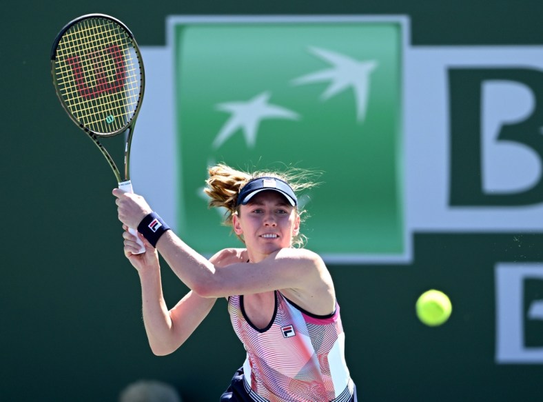 Mar 11, 2022; Indian Wells, CA, USA; Ekaterina Alexandrova (RUS) hits a shot in her 2nd round match against Simona Halep (ROU) at the BNP Paribas Open at the Indian Wells Tennis Garden. Mandatory Credit: Jayne Kamin-Oncea-USA TODAY Sports