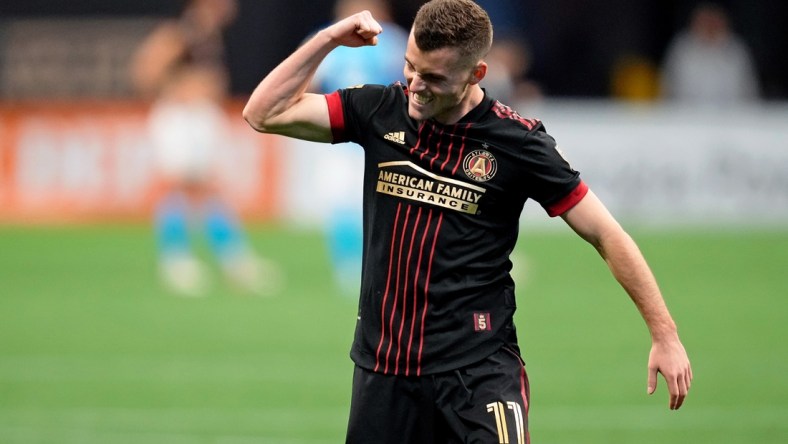 Mar 13, 2022; Atlanta, Georgia, USA; Atlanta United defender Brooks Lennon (11) celebrate their win against Charlotte FC during the second half at Mercedes-Benz Stadium. Atlanta United won 2-1. Mandatory Credit: Dale Zanine-USA TODAY Sports