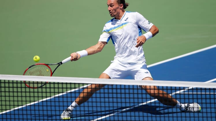Alexandr Dolgopolov, of Ukraine, approaches the net in the second set to return a shot to Novak Djokovic, of Serbia, their semifinal match, Saturday, Aug. 22, 2015, at the Lindner Family Tennis Center in Mason, Ohio.Xxx 082215 Tennis 06 Jpg S Ten Usa Oh