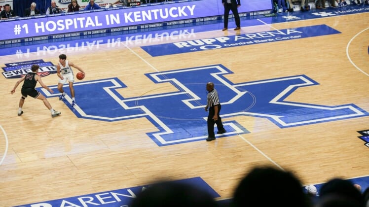 Kentucky-commit Reed Sheppard brings the ball up the court atop the large UK logo at the UK HealthCare Boys Sweet 16 tournament Wednesday at Rupp Arena. March 15, 20222022 Sweet Sixteen Boys Basketball Tournament